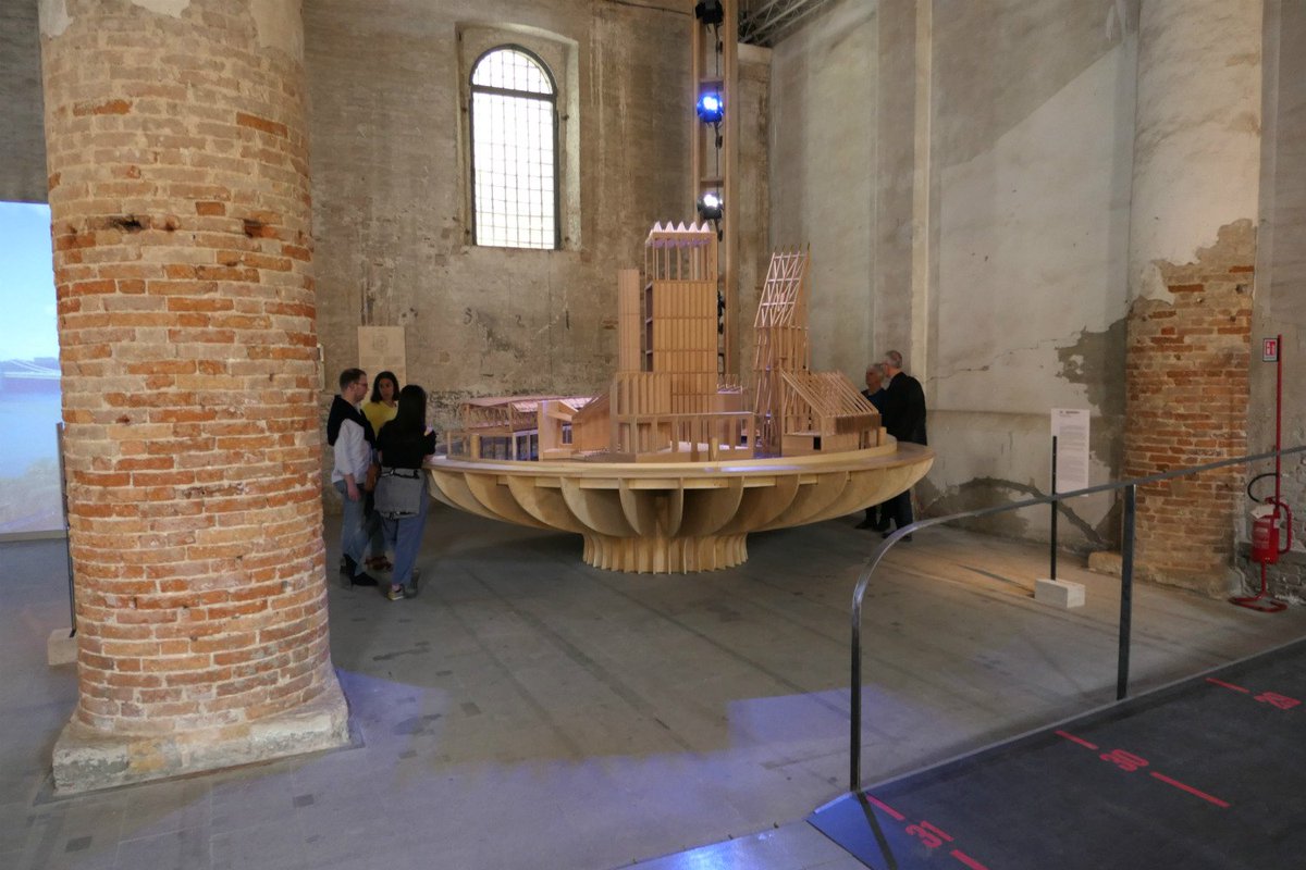 RIBAJ's tweet photo. Architects occupy the side-aisles with their interpretations of #Freespace. Here's Niall McLaughlin's rotating cosmological model table, a city of his own buildings..../3 https://t.co/oT5346RK7A