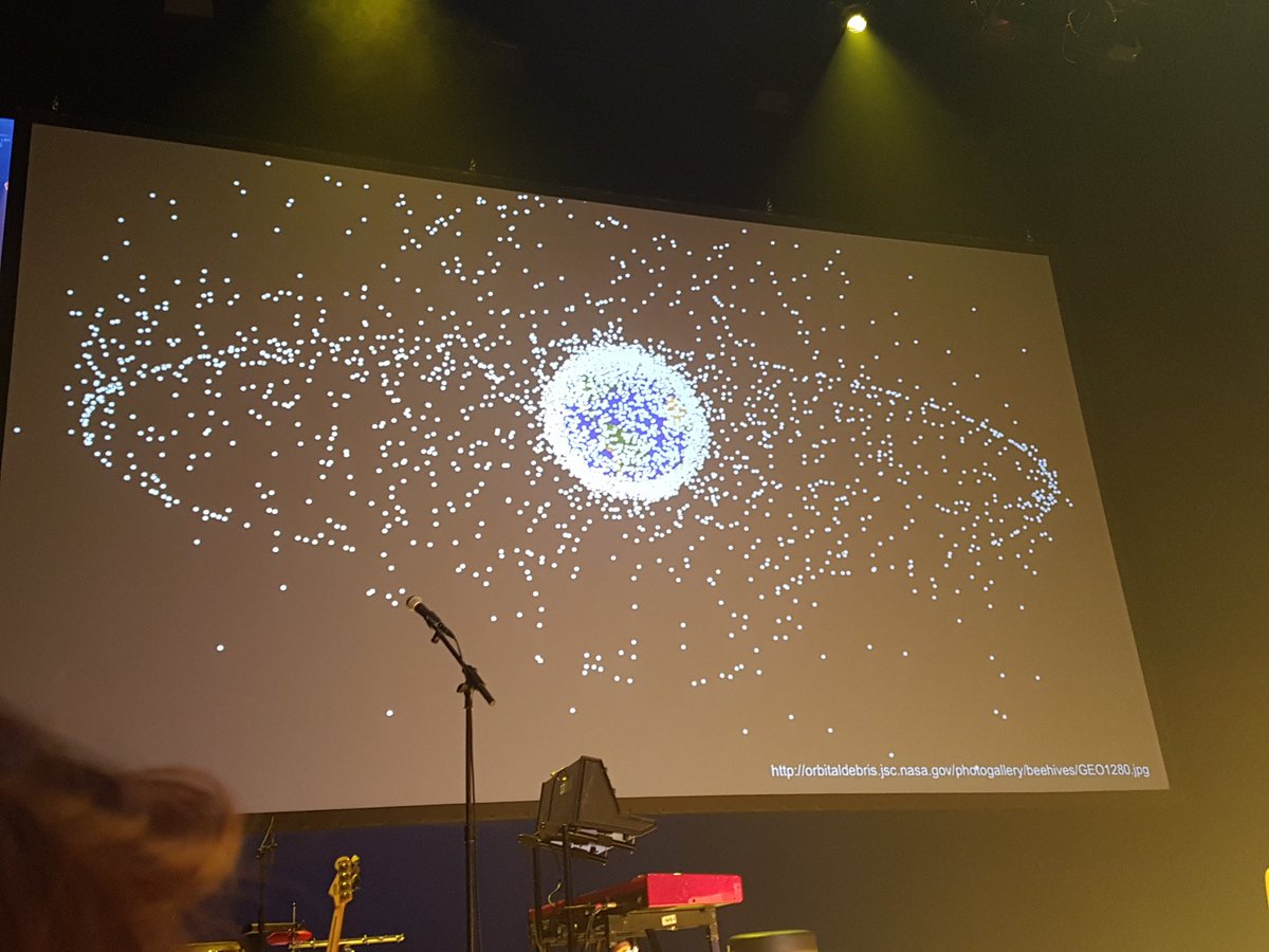 commgoodco's tweet image. Live from @WhatDesignCanDo , looking at the challenge Joel Towers (Parsons) highlights to kick off this morning set of keynotes. This is a picture of our blue planet... surrounded by orbital debris. #whatdesigncando #anthropocene #parsons #redesigndesign #goodmorning