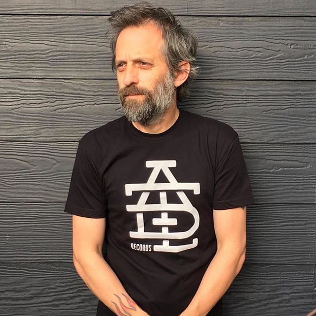 RudolphDesign's tweet photo. Hot off the presses, new @aditlrecords shirts with the logo I did for them on front. Modeled by the wildly talented and ruggedly handsome double threat @manalivecreative Quite the collaboration in one photo. #adayintheliferecords #manalivecreative #graph… https://t.co/WTr7N2VMtk https://t.co/xY6nXWOAYr