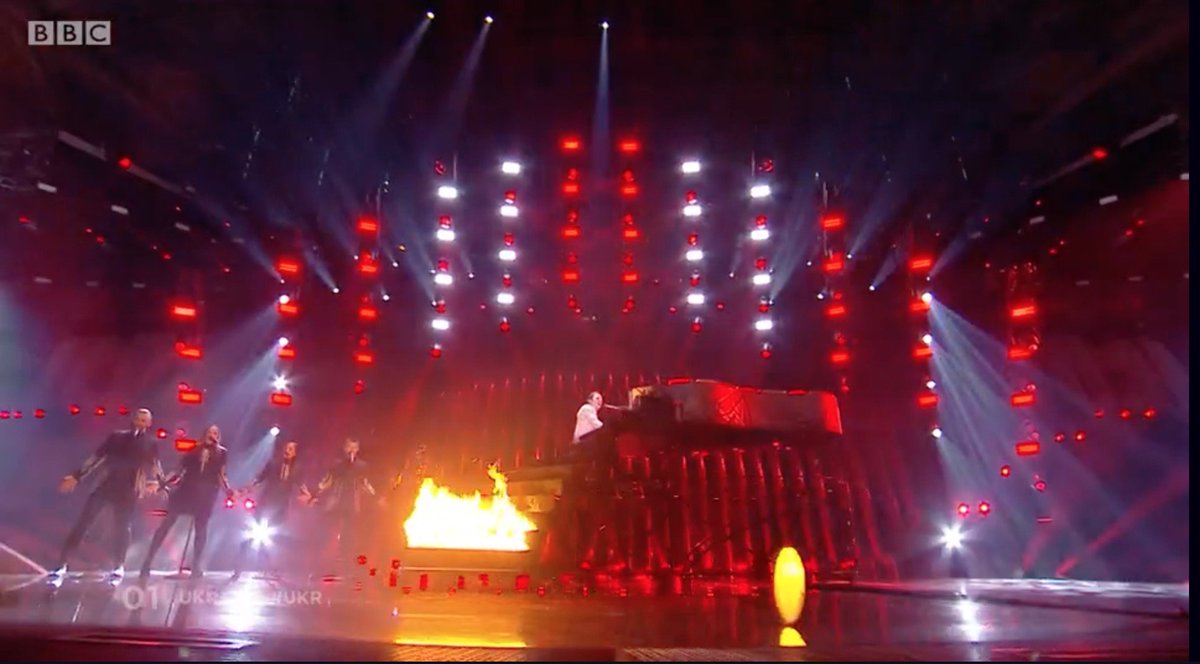 SwearyBerry_'s tweet photo. “Bit of cash left in the budget lads. Anything else you want?”
“Coffin in a piano on stilts?”
“Sure.”
“Can we set it on fire?”
“Yeah, fuck it.” 
#UKR #Eurovision https://t.co/DD7CrnOp2i