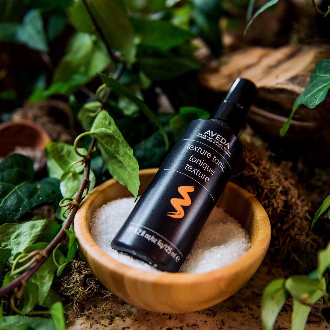 aveda's tweet photo. #TextureTonic is a versatile styling spray for everything from beachy waves to braids. It's made from a mix of salt and sugar to keep your style looking effortless without feeling crunchy. It's like a day at the ocean in a bottle — no sunscreen required. https://t.co/807dFa8Kac https://t.co/4FS47Emr9B