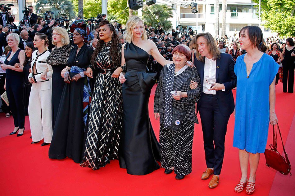 Tribeca's tweet photo. Agnès Varda, one of only two women directors to be awarded a Palme d’Or, at the 1962 Cannes Film Festival with actress Corinne Marchand for CLÉO FROM 5 TO 7 and at this year’s festival with Cate Blanchett, @Ava DuVernay, and more, leading today’s 82-woman march for gender parity. https://t.co/UhZ71aklRf