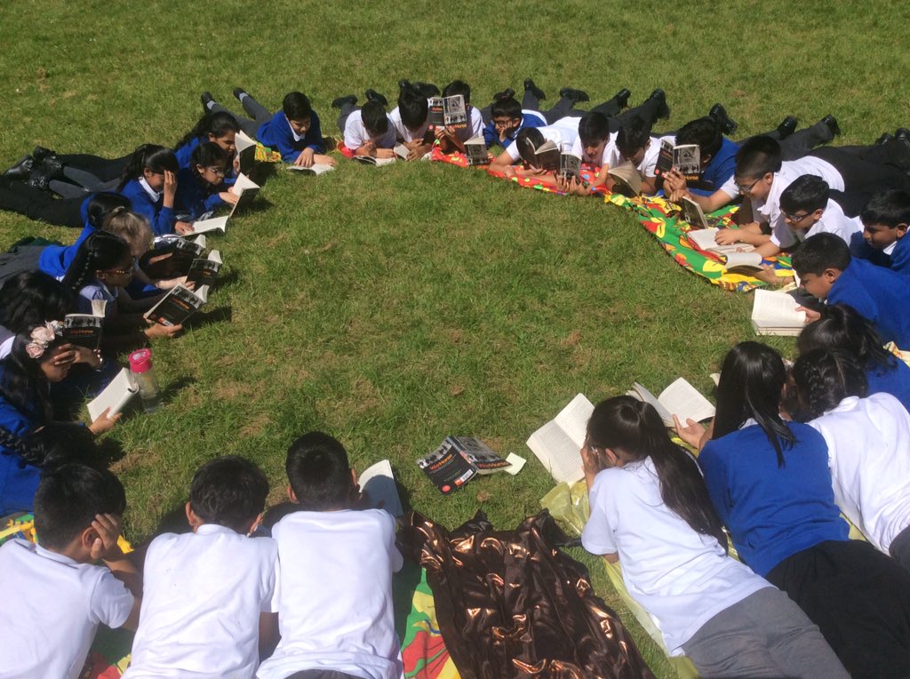 CarleyMetcalfe's tweet photo. Lovely, chilled half-hour at the end of today. Class novel in the sun. 😎 I'm so proud of this bunch! 💙 #year6 #reading #SATs #warhorse #t4w https://t.co/V0a9YI60Mi