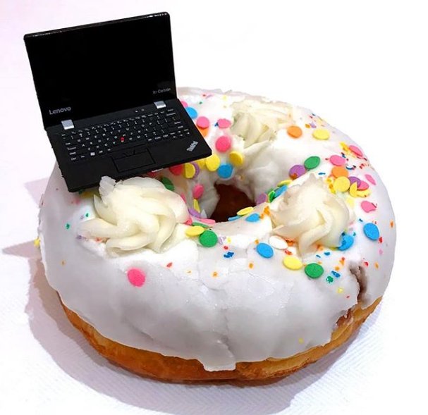 Lenovo's tweet photo. YOU MAKE THE CALL: Tiny laptop or giant donut? https://t.co/8XF5ynLGZ2