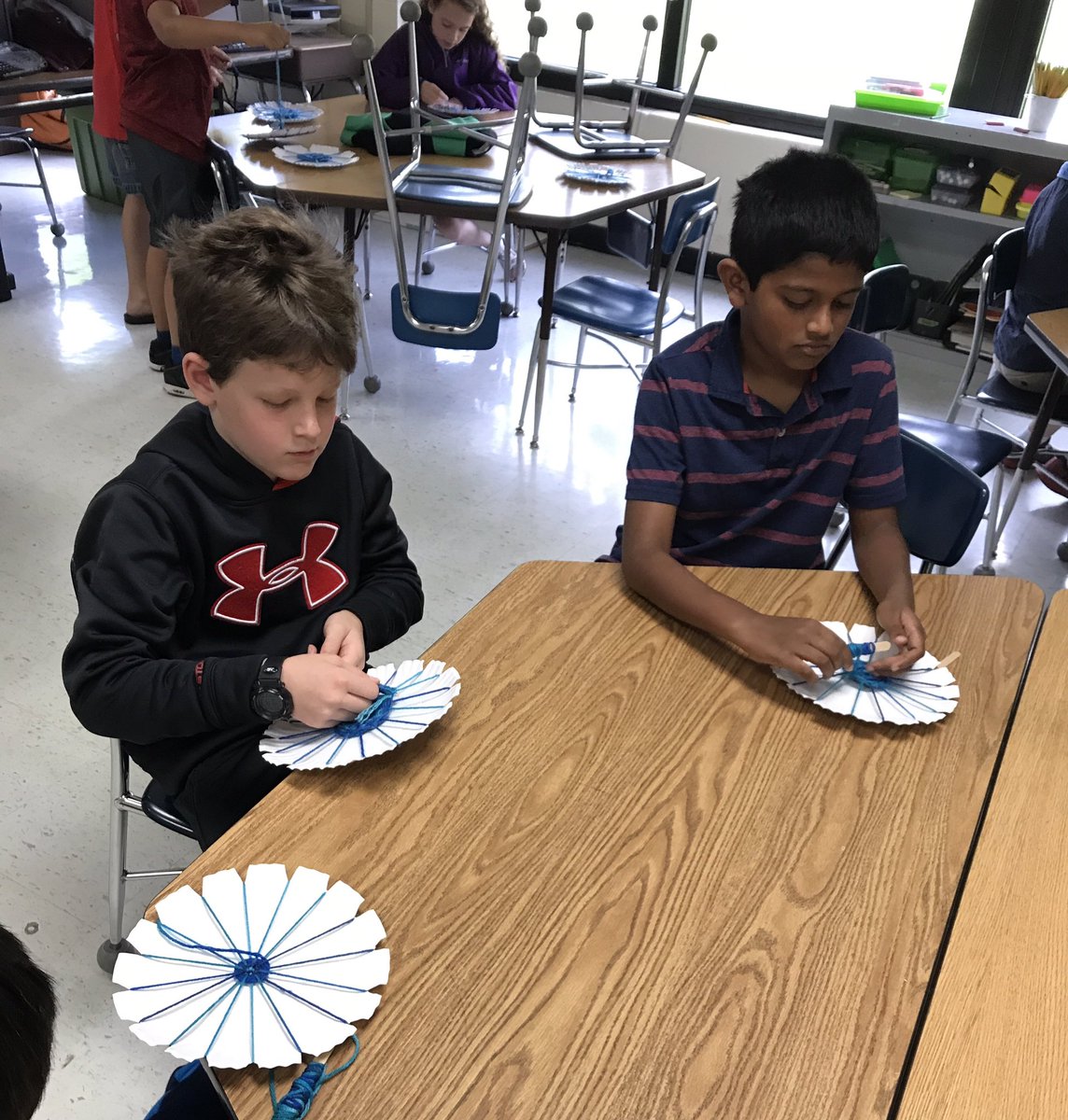WoodlandHawks's tweet photo. After reading a fiction story about weaving, #secondgradeWL weaved coasters for Mother's Day. #TheGoatInTheRug https://t.co/rX6UGR8wnM