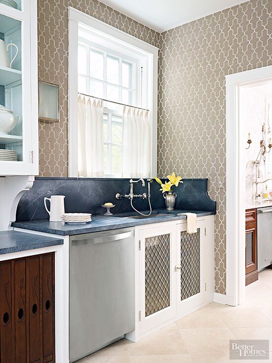 We spy a lot of fun textures and patterns that add extra charm to this kitchen design. Featuring the ROHL Acqui Wall Mount Column Spout Bridge Kitchen Faucet with Handspray. #AuthLux <a href="/BHG/">BetterHomes&Gardens</a> spr.ly/6017DeNvP
