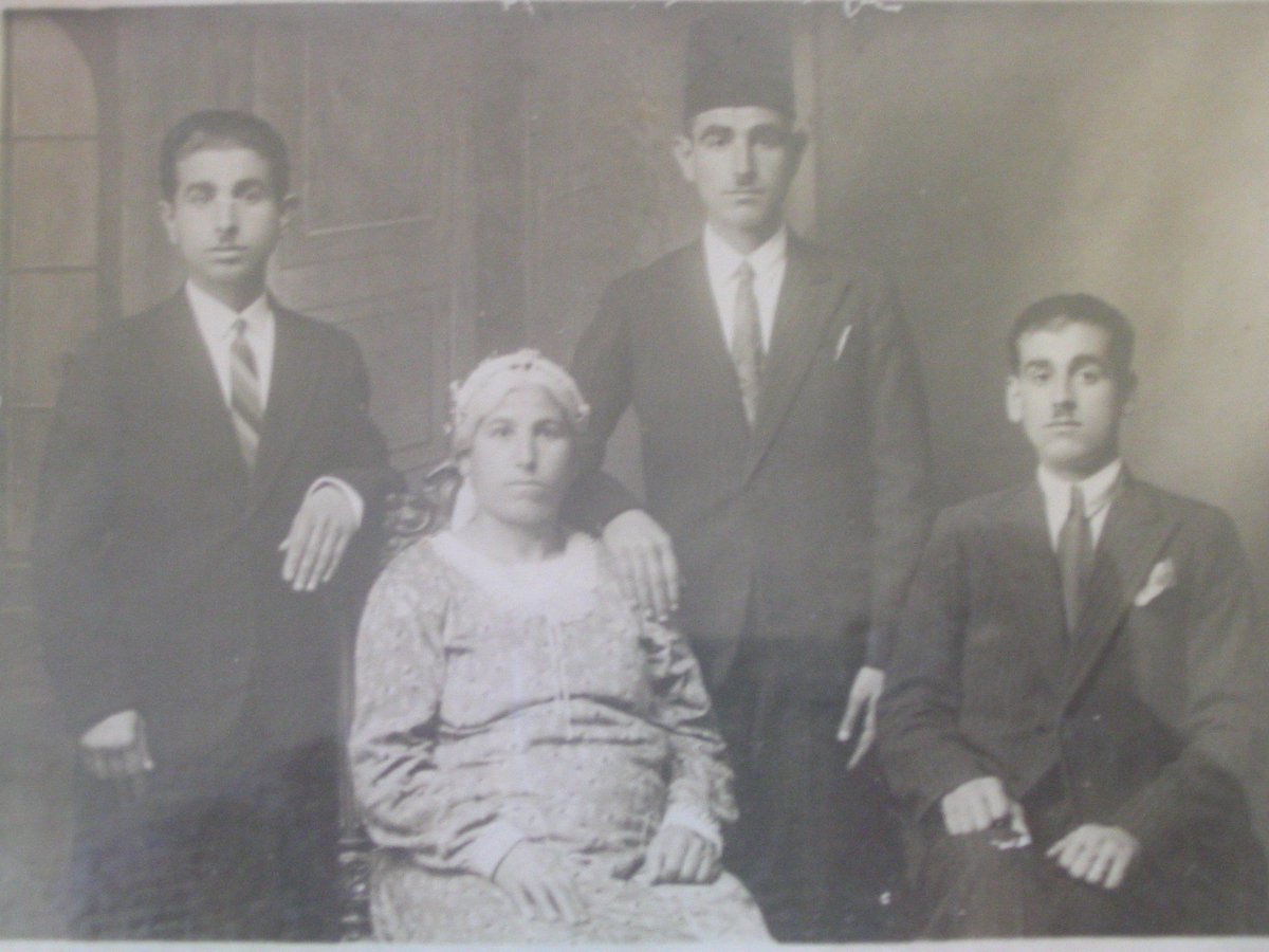 Have a look at this picture from Palestine. The young man on the left is my Sido (grandfather). This is from the late 1920s to early 1930s. My great grandmother is seated in the foreground with her three sons behind her. They are from al-Lyd.
