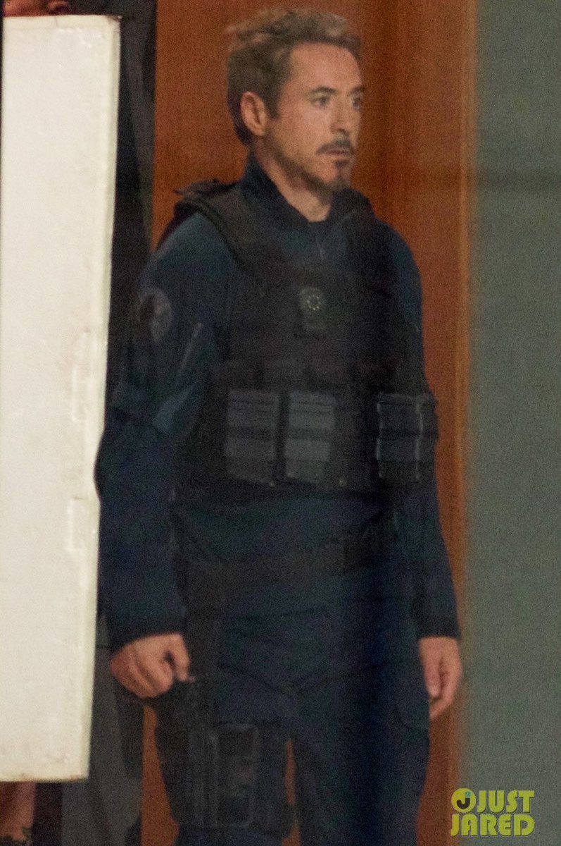 Lokieed's tweet photo. I’M LATE BUT I just realised that this has to be time travel and not a flashback because there are two Tonys in the same place?? (see the door behind loki and tony) ALSO someone removes the muffle and the shackles from loki’s wrists I swear if present Tony talks to past loki IM- https://t.co/FuHOQGqg41