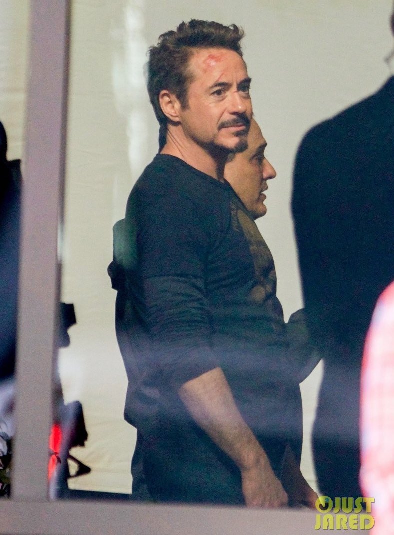 Lokieed's tweet photo. I’M LATE BUT I just realised that this has to be time travel and not a flashback because there are two Tonys in the same place?? (see the door behind loki and tony) ALSO someone removes the muffle and the shackles from loki’s wrists I swear if present Tony talks to past loki IM- https://t.co/FuHOQGqg41
