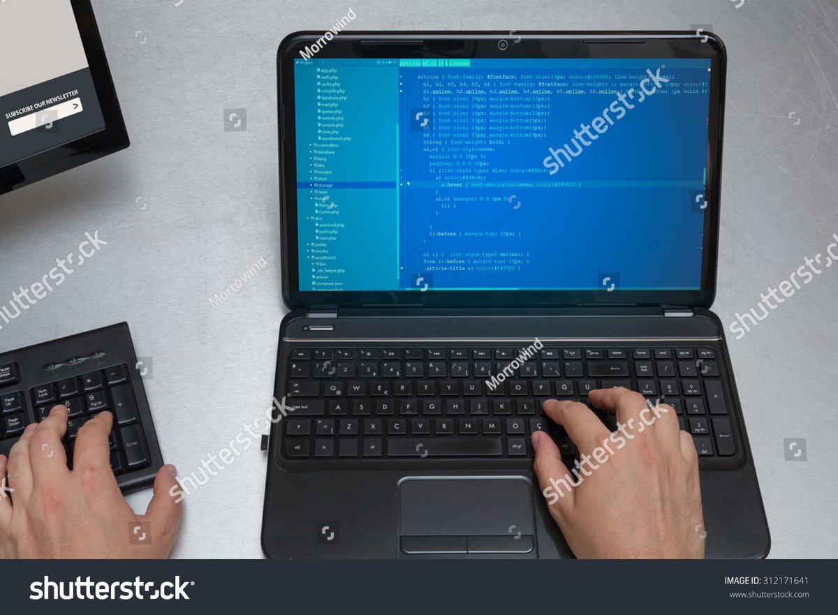 hello_coleen's tweet photo. My day typically consists of typing simultaneously on 2 keyboards and coding horribly structured code in the worst editor theme you can find #BadStockPhotosOfMyJob https://t.co/5OjpGc21JQ