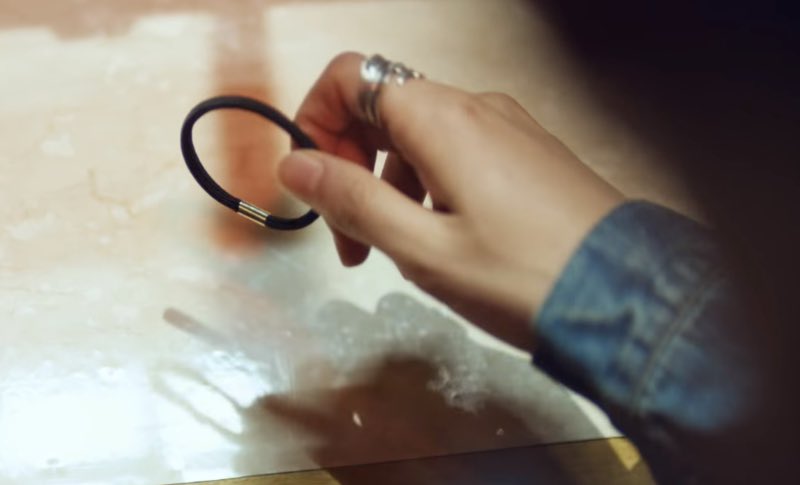 Then what does he trade it with?The object Namjoon receives is hair tie.What does this hair tie symbolize? Why does it look familiar?