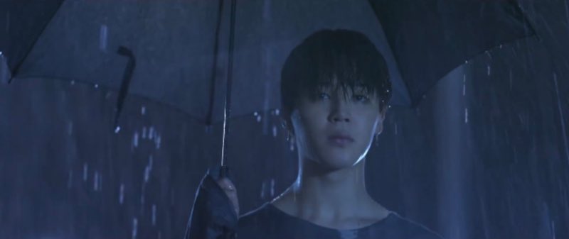 It links to the umbrella Jimin was using in the LOVE YOURSELF Highlight Reel.But one thing to notice is that Jimin’s soaking wet throughout his entire body and head despite being under an umbrella.What is this trying to say?This goes back to HYYH.
