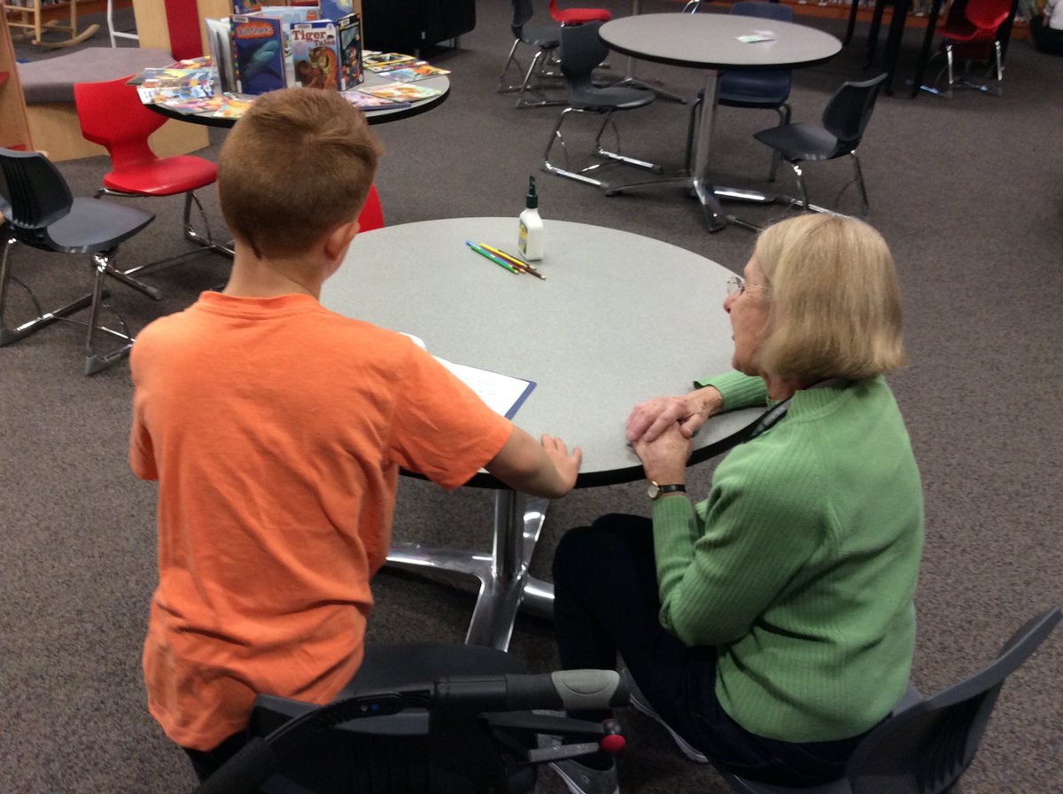 MrsBathsClass's tweet photo. Student author sharing his published story with one of our wonderful volunteers. https://t.co/hbDVar1Y1S
