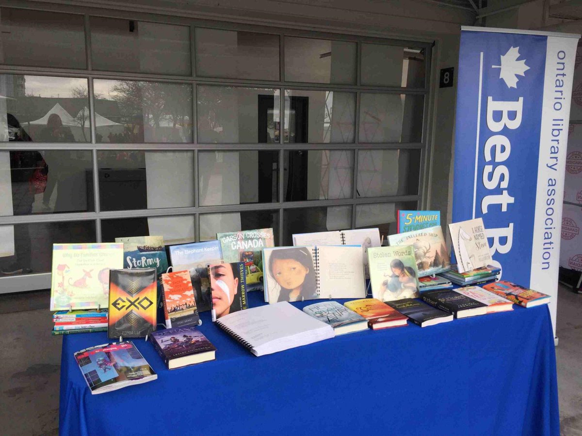 CELAeducator's tweet photo. Our Content and Access Librarian Theresa Powers is volunteering with Best Bets at today's Festival of Trees. Stop by to say hello and check out #accessible versions of Stolen Words and Marrow Thieves. @ForestofReading https://t.co/t84UxNGCLT