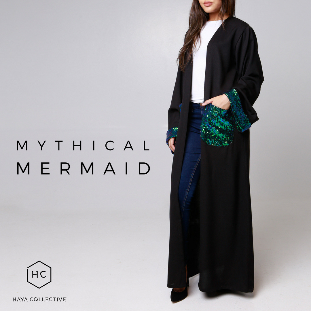 HayaCollective's tweet photo. We’ve added just a splash of sequin shine along the cuffs &amp; pockets, in iridescent colours reminding us of the allure of the ocean.
Shop the limited edition #Mermaid Abaya (R1199) at https://t.co/rCfNxtq764.

#Eid ‘18 orders close at midnight on Sunday, 20th May.
#Ramadan #Abaya https://t.co/EevdQBeXB4