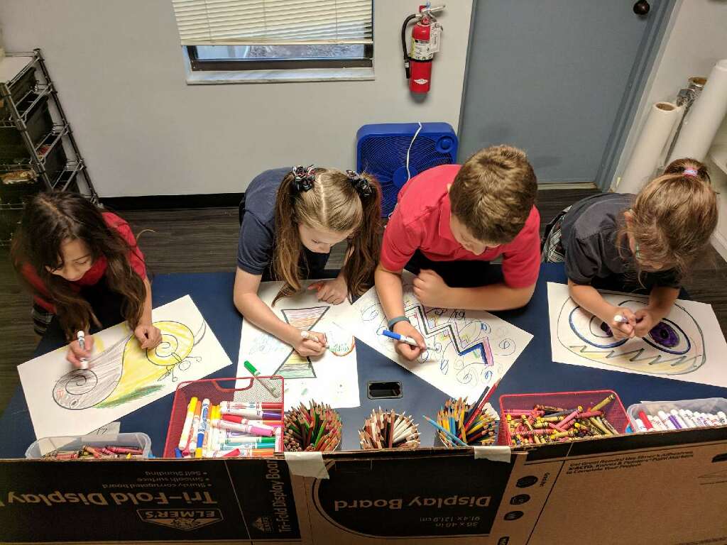 SEA_Today's tweet photo. 3rd Grade had fun @ STEAM Lab. The students were put in teams of 4 &amp; took turns drawing on the same picture. Each team was assigned a shape to start. The students had no idea what the person in front of them drew or the plan for the overall image. Creativity! https://t.co/gosV0Te95s