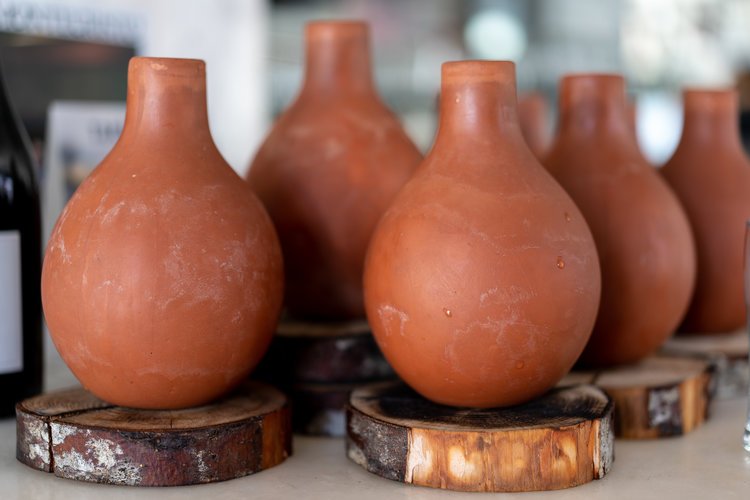 Eye-catching keepsakes from Peru and Mexico lined the kitchen counter of <a href="/cacaovancouver/">Cacao</a> , playing its part in creating a unique and authentic dining environment. Visit the link below for the story behind this progressive latin restaurant in Vancouver. bit.ly/2rMEYsJ