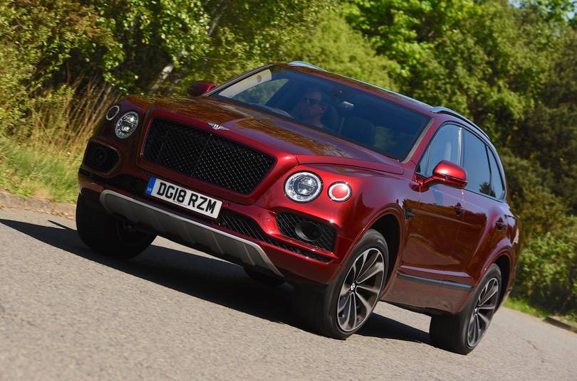 whatcar's tweet photo. For a car that sells in such relatively low volumes, it’s remarkable that the Bentley Bentayga now offers a choice of three engines – we drive the new 4.0 V8 petrol version https://t.co/wFhg6RbPsS https://t.co/8zGxPshCIe