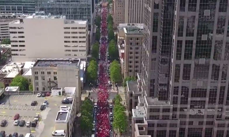 RedTRaccoon's tweet photo. Amazing sights coming out of Raleigh, North Carolina as thousands of teachers march through downtown.

A massive blue wave is rising from this sea of red.

#redfored #red4ed #ncteacherrally #RallyForRespect https://t.co/FUwiJsYshe