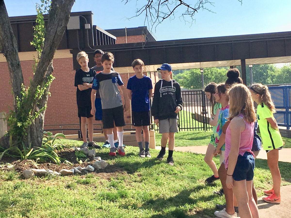 The big reveal!  A1 Stretch presents their PBL projects:  6th Grade Hallway signage for newcomers and brand new landscaping for a formerly neglected tree.  Way to go, 6th graders!  #crestviewmiddle #cmslearns #cmsleads #wearerockwood