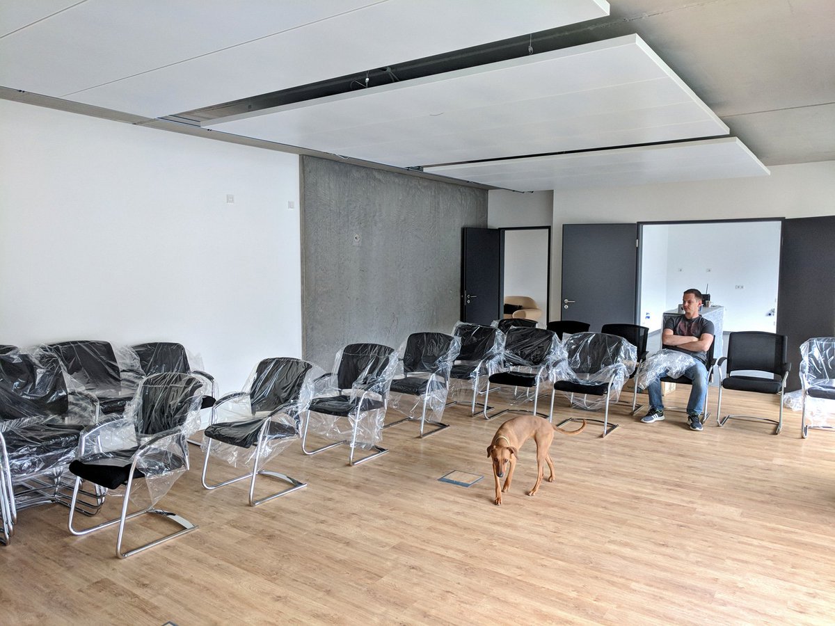 DFAU's tweet photo. As @tom_noise might look a little grumpy: Let's just guess he's thinking of endless possibilities gathering developers and sharing knowledge. Thanks to a little bit more space. #typo3 #comfy #grumpydev #andadog https://t.co/pt6tEYCTP3