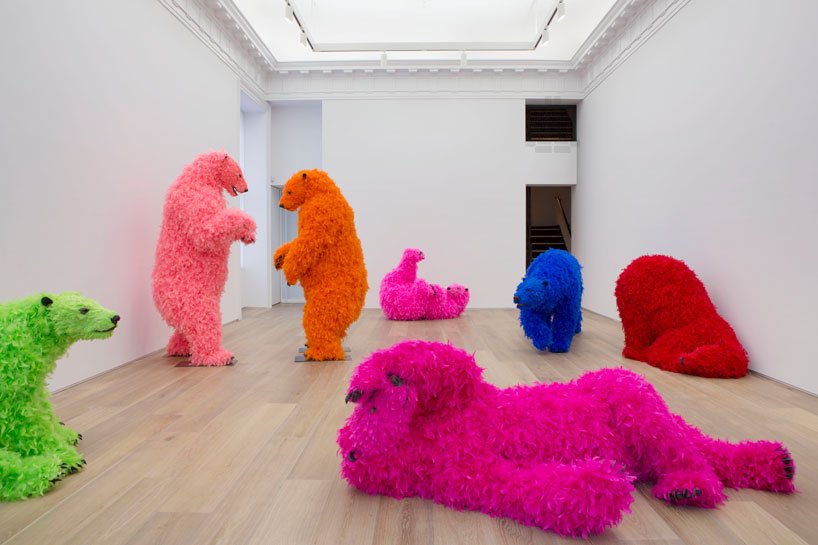 womensart1's tweet photo. Italian artist Paola Pivi, ' You started it … I finish it', 2014 installation of eight life-size sculptures of polar bears adorned with neon-coloured feathers #womensart https://t.co/38WXwhJYIY