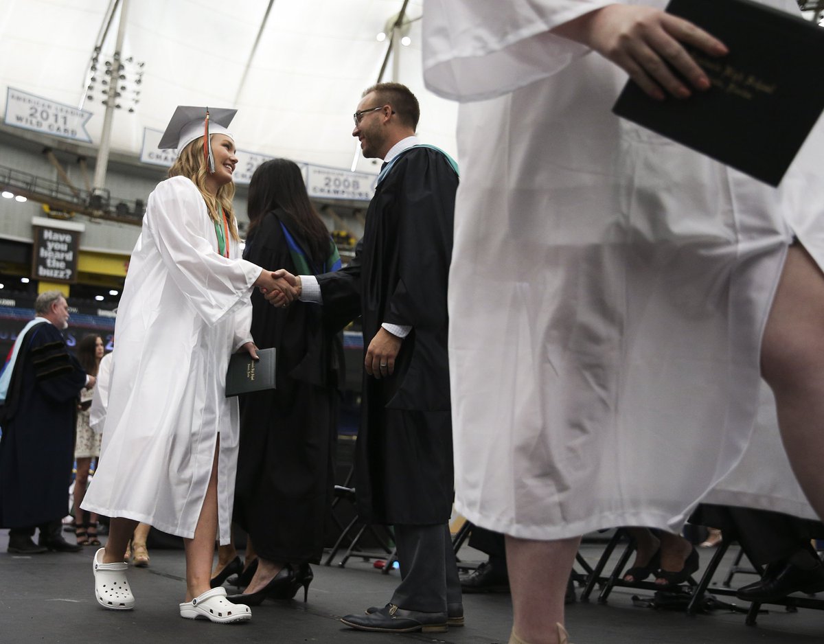 DirkShadd's tweet photo. Seminole High School seniors sport their white @Crocs during Class of 2018 #graduation2018 at Tropicana Field in @StPeteFL @sarahagee11 #PCSGrads @my_pcs https://t.co/zLSBDeH2au