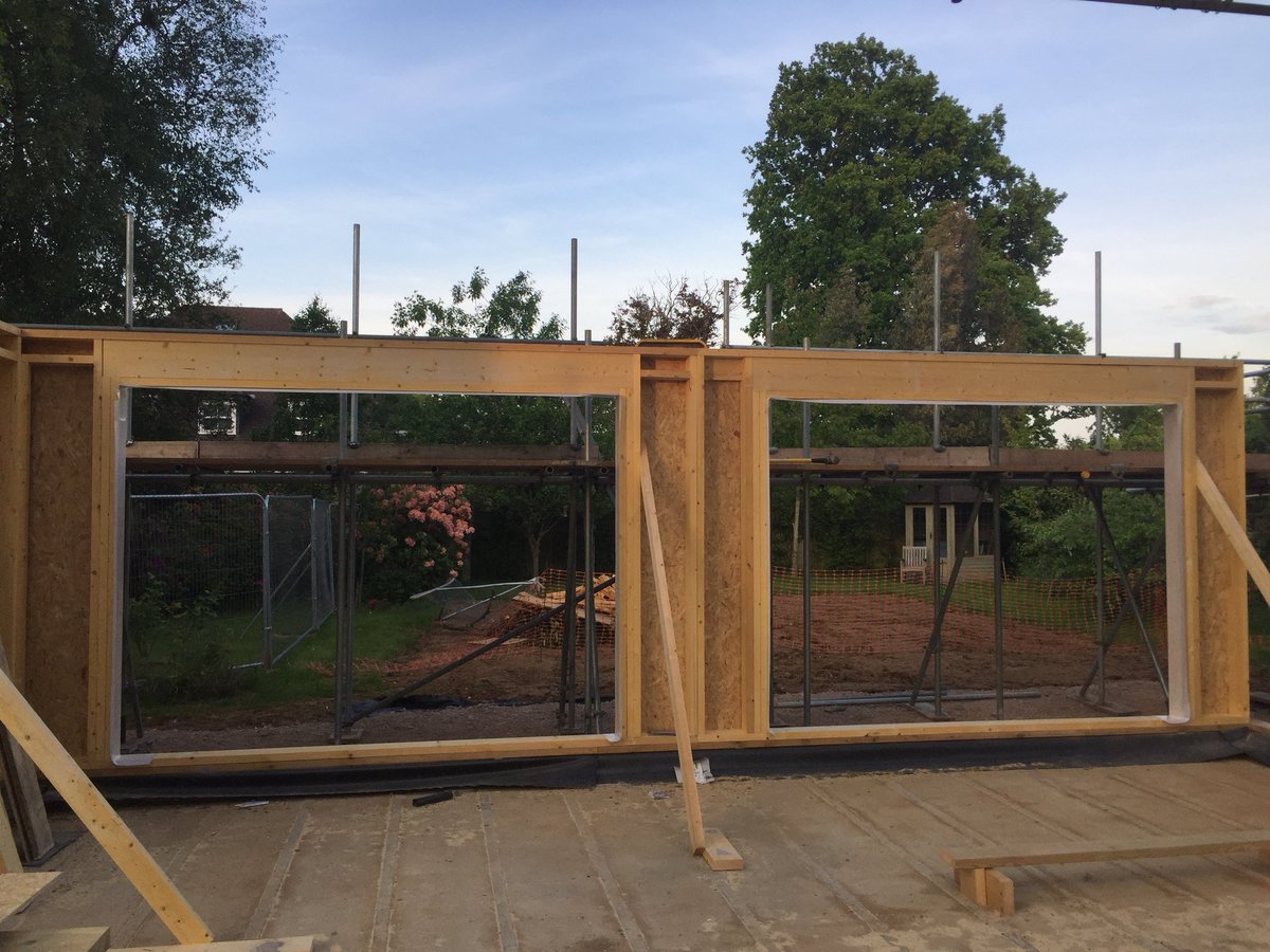 broxholm_KT20's tweet photo. We have a front door (well kind of...use your imagination...) and the view from the sunroom is looking good too..! #selfbuild #timberframe #benjaminallen https://t.co/qvEz9lGrtD