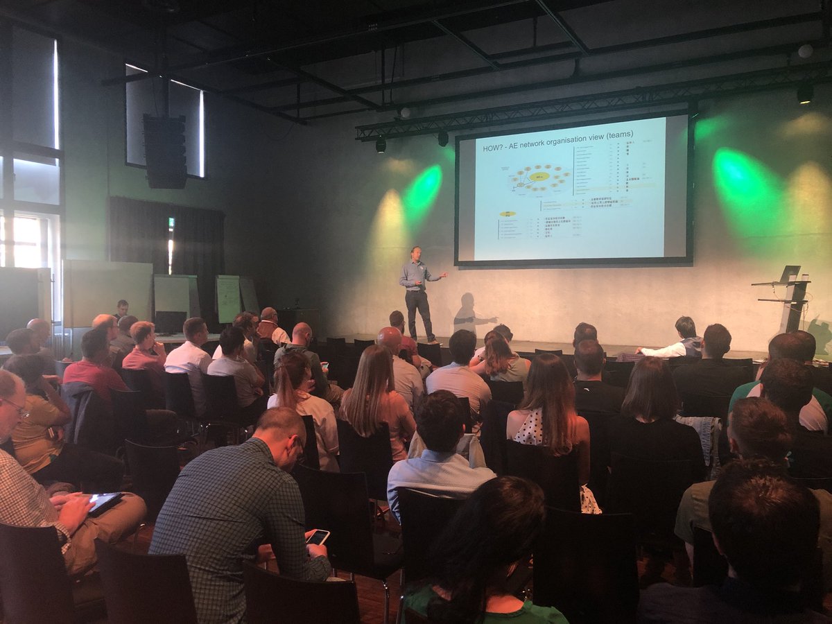 frontkom's tweet photo. Its the second day of @#TargetConf2018, very interesting lightning talks - Jürgen Müller on stage discussing #DigitalTransformation of a Swiss hospital founded in 1354 AD! @targetprocess https://t.co/bETSSqj4D1