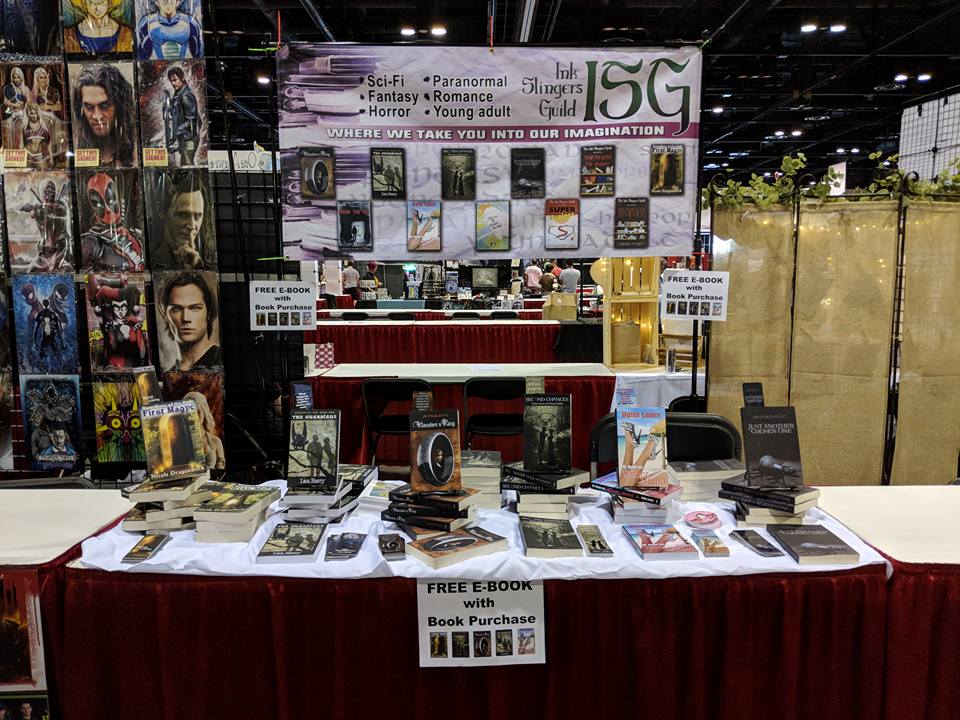 DragonBeck's tweet photo. So exciting!!! @InkSlingers @AlannaRubin @AuthorELance @authorlisabarry @authorjmp @coolerbs and yours truly representing at #OrlandoMegaCon - love the amazing banner (and who's watching over my book) 😍😍

#writerslife #awesome #LokisArmy #GuardiansOfThePath @witchinghourpub https://t.co/wWw5jZdR7m