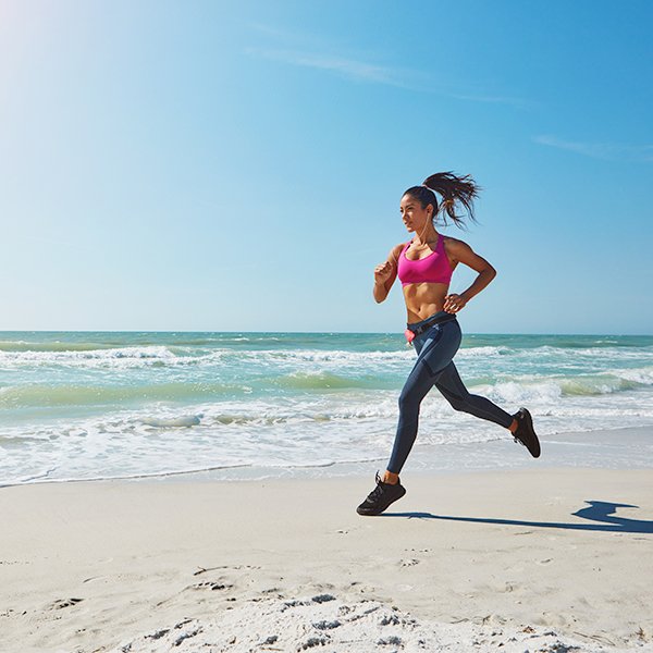Who enjoys the crash of waves during a run on the beach?