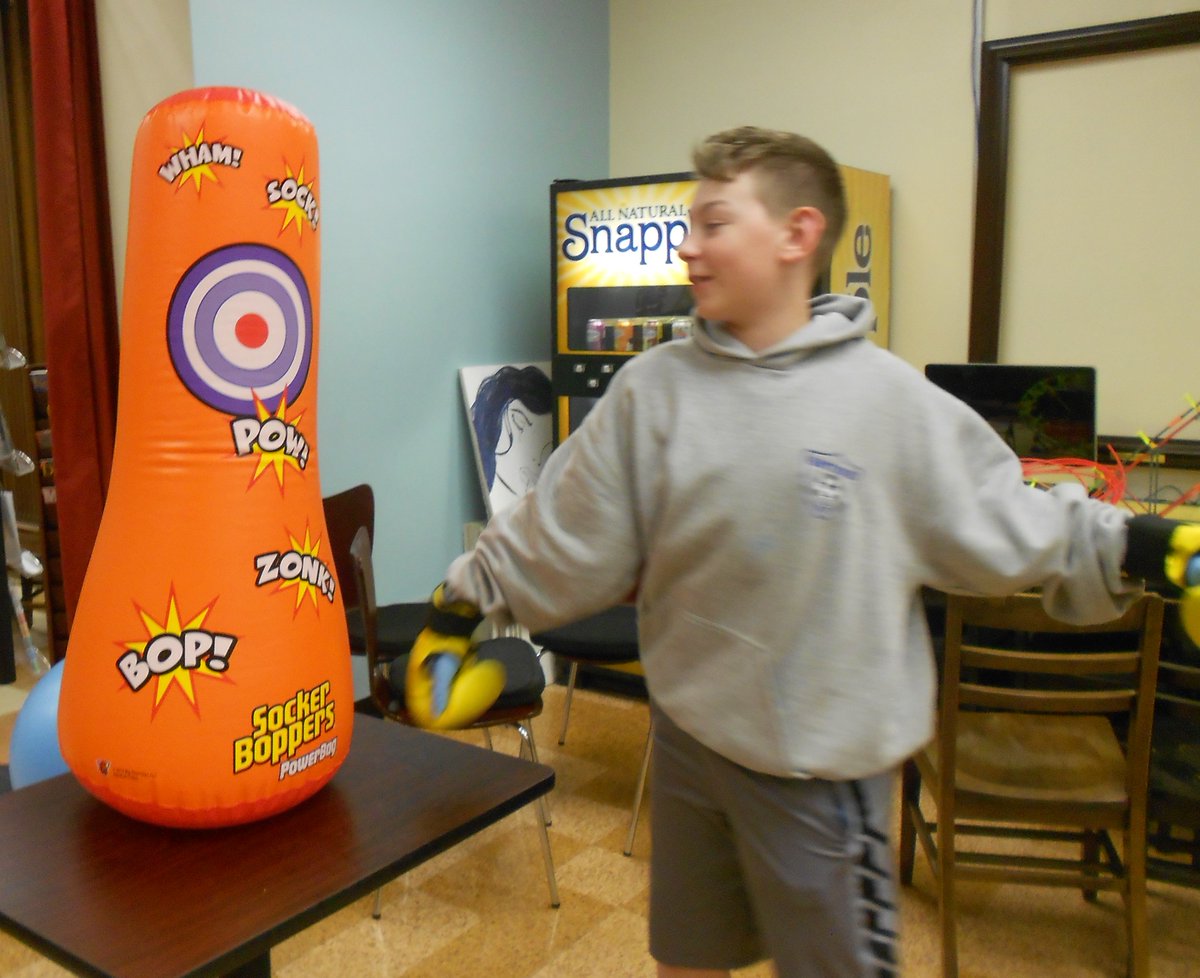 LibraryatHHS's tweet photo. "Let Stress Go" library workshops continue today w/ Box/Bike/Bounce activities to release that stress. Using a boxing dummy, stationary bike, and exercise ball, our students laughed away their frustrations during lunch! @HHSBears @NJASL #exerciseforstress https://t.co/QTrUB6FTfI