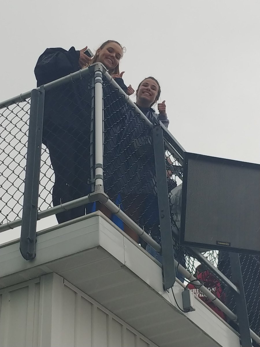 My 300 hurdlers watching Robyn run the 100s in the rain.