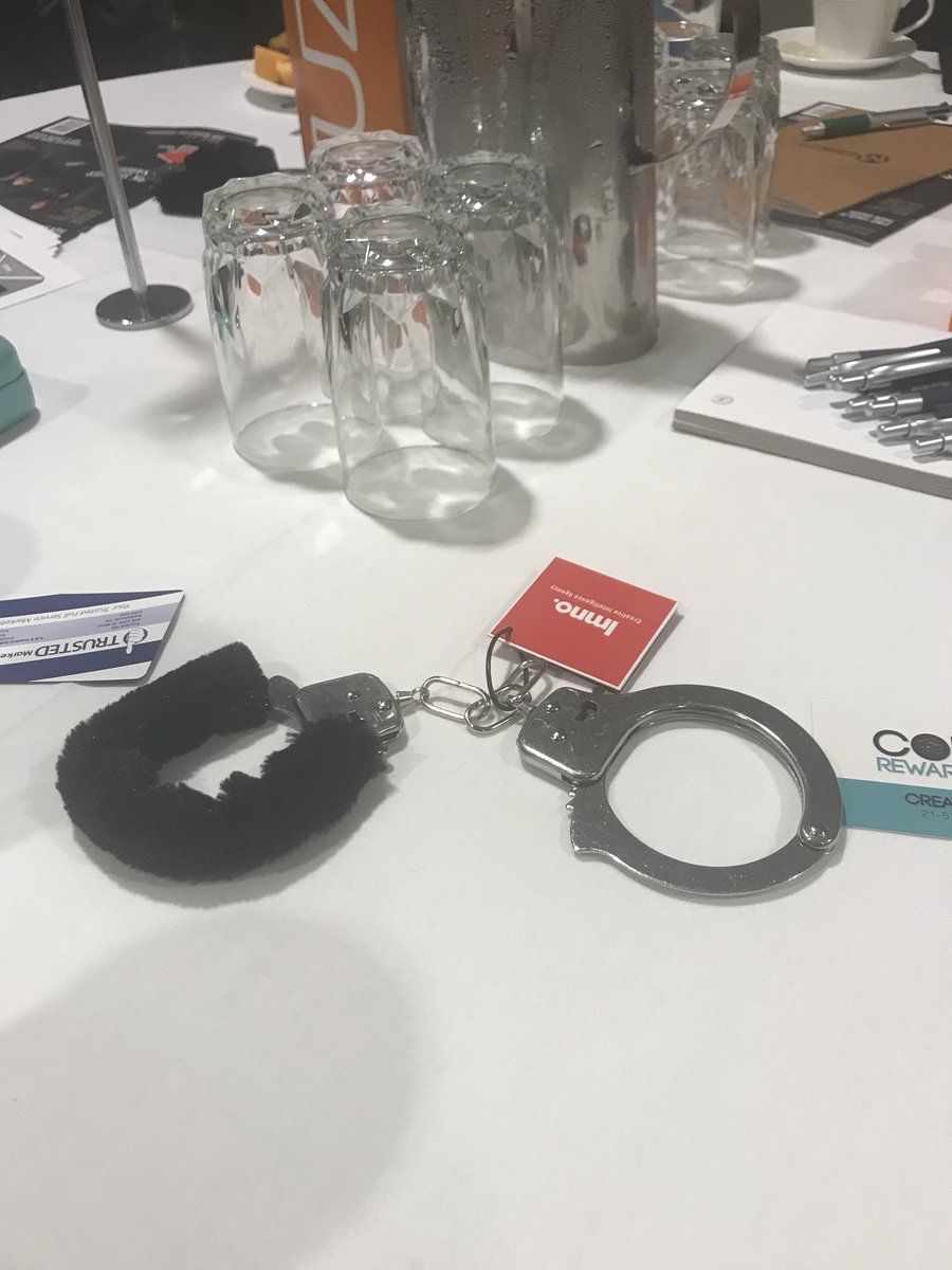ericaschindel's tweet photo. You know it will be a great conference when there are handcuffs on the table....#fuze2018 https://t.co/jDfgmrXrZK