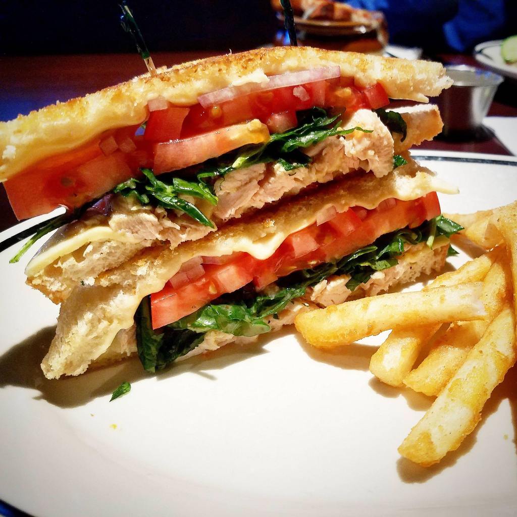 Roasted chicken, marinated baby kale, swiss cheese, tomato, red onion and dijon on griddled sourdough
