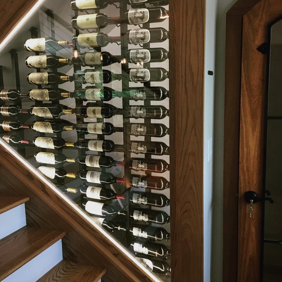 ModWineCellars's tweet photo. Not quite under the stairs wine racks with a view. You won't be able to go up and down the stairs without wanting to pour another glass. Designed by #Wineracksamerica https://t.co/LyRj7j0ewf