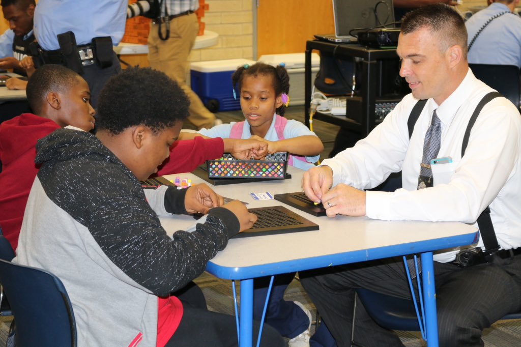 SLMPD's tweet photo. Check out photos from the "Non-Violent Video Game Challenge" at Herbert Hoover @BGCA_Clubs. Special thanks to all the officers as well as @jarms90 and @bloxelsbuilder for teaching us how to make our own video games while building bridges with the community! #CommunityEngagement https://t.co/gaAZxWKjDA