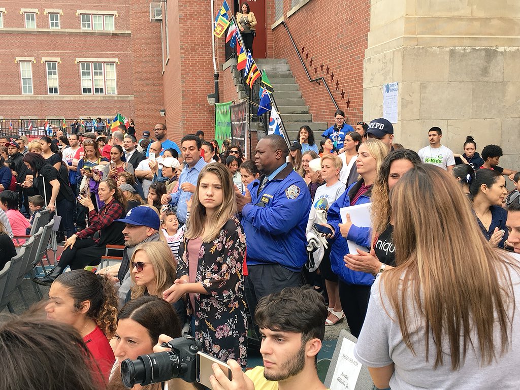 NYPD104Pct's tweet photo. The rain didn’t stop these bright students from shining. A great turn out at the #Unique Unity Fair @PS88. Children were given awards, they walked down a #RedCarpet and on to a stage! Beautiful multicultural performances done by the students. #Unique #NYPDConnecting #Ps88 https://t.co/vytfTQs9U4