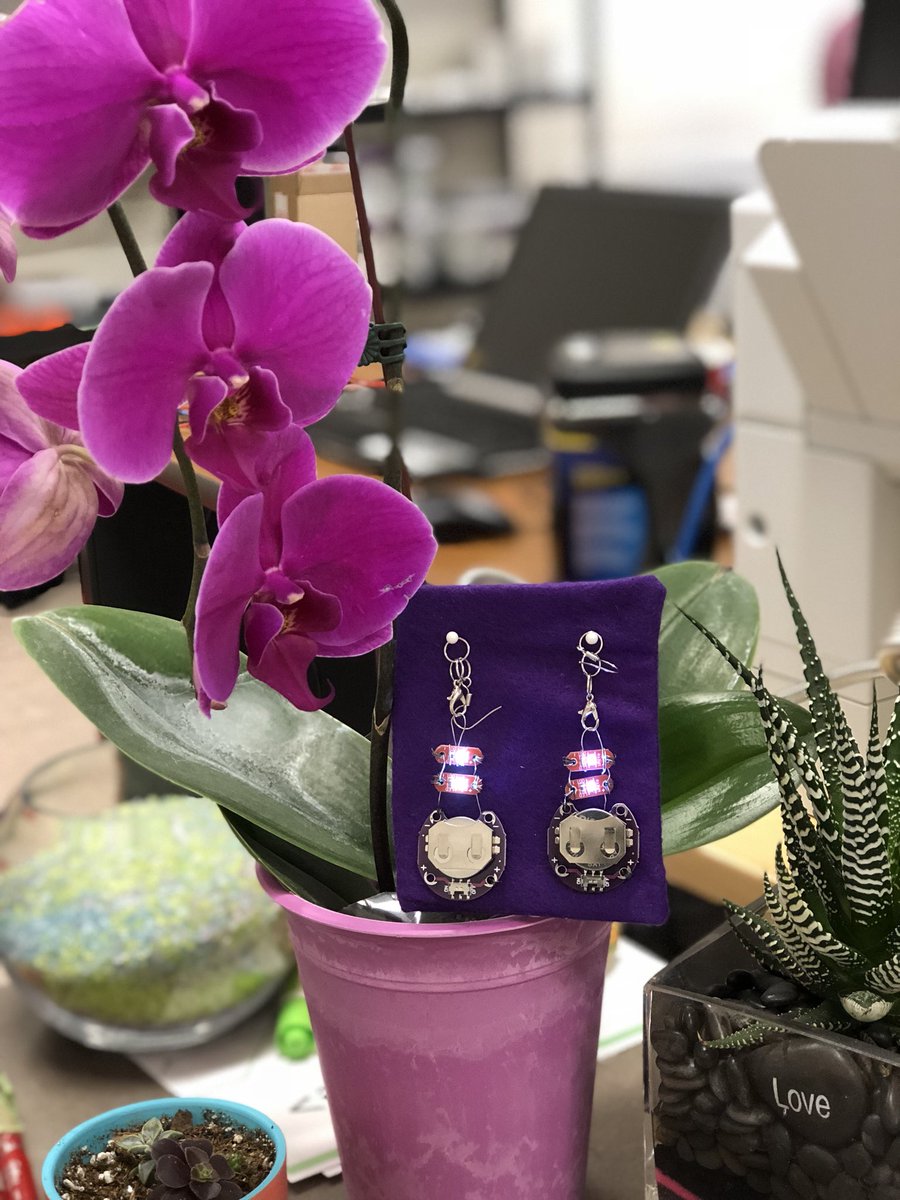 mitchmea's tweet image. A pair of earrings I made using materials from the LilyPad kit from #SaskCode. These kits will be available Fall 2018! Great intro to #electronics and a nice lead up to computer programming with #Arduino @saskatooniec #cancode #edtech #edsci #edchat