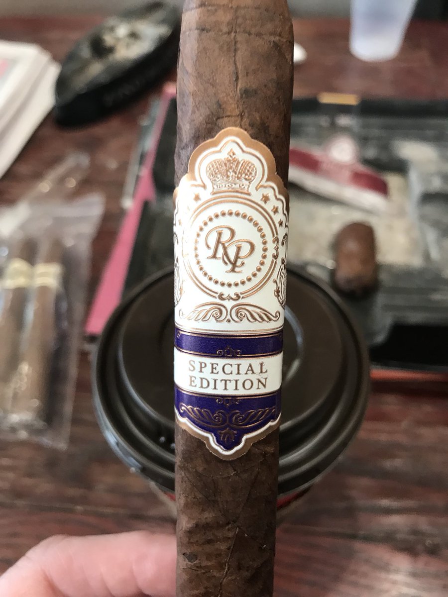 Trying out this <a href="/RockyPatelCigar/">Rocky Patel Premium Cigars</a> at #CigarAficionSI event. Let’s see how this goes with <a href="/TimHortons/">Tim Hortons</a> dark roast @CigarChairman <a href="/JeffBOTL/">JeffBOTL</a> @ParadigmPres <a href="/sacredsmokes/">Pastor Padrón</a> <a href="/PistolCliff/">Cliff Wilson</a> <a href="/HN_JAD/">Houston-JD</a> <a href="/Mack280/">Gerald McIntyre</a> <a href="/Xavier9281/">Joel "Inked Life” Morgan</a> <a href="/cigardetective/">Ricardo Nascimento</a> <a href="/NathanCaliendo/">Nathan C</a> <a href="/notbuncy/">Buncy, Steering Wheel holder, easy bake oven user</a>