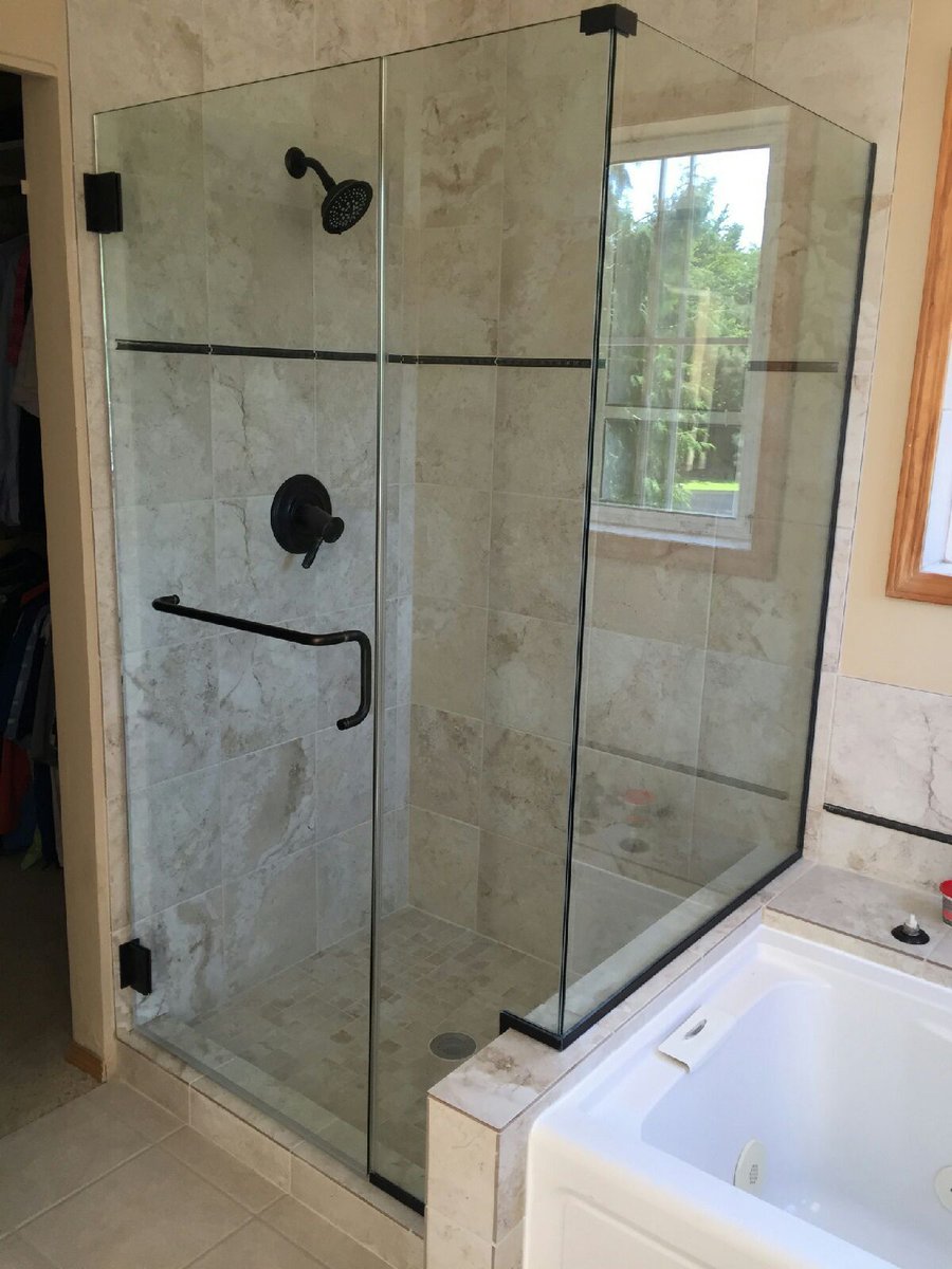 This shower's light tile gives great contrast to its oil-rubbed bronze faucet. 
View more of this project here: bit.ly/2wA7fIr
  
#Tile #OilRubbedBronze #Carnation #Renovation