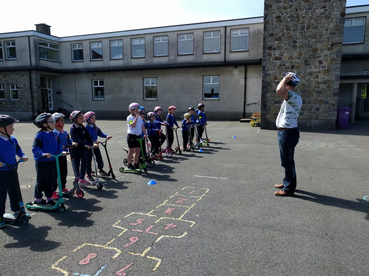 Gnmgreenteam's tweet photo. Thanks to @GreenSchoolsIre we have  scooter training #funinthesun! Think @microscooters will recognise some of our helmet prizes for #scoottoschoolweek! Thank you! https://t.co/ctjIsryLI2