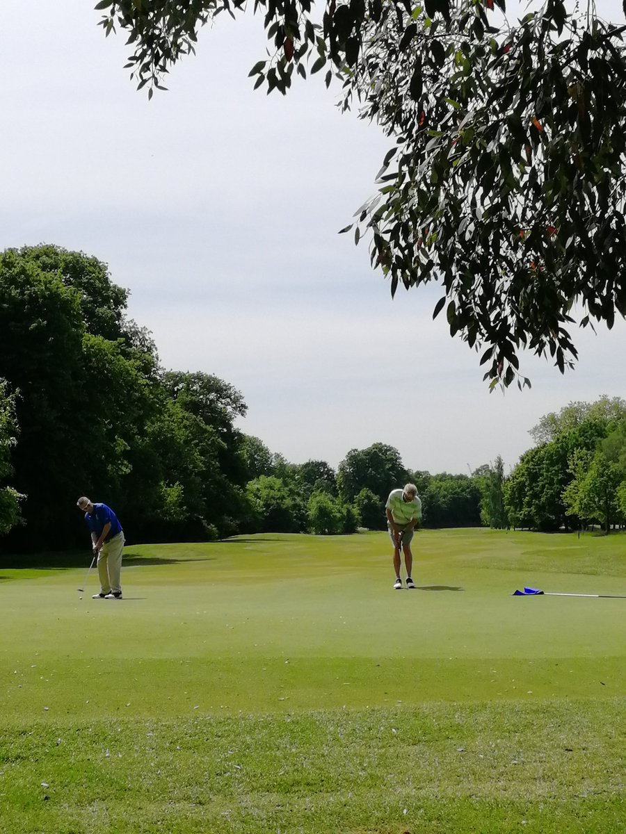 <a href="/TheRichmondGC/">Richmond Golf Club</a> Captain and immediate past captain trying to hole a putt.