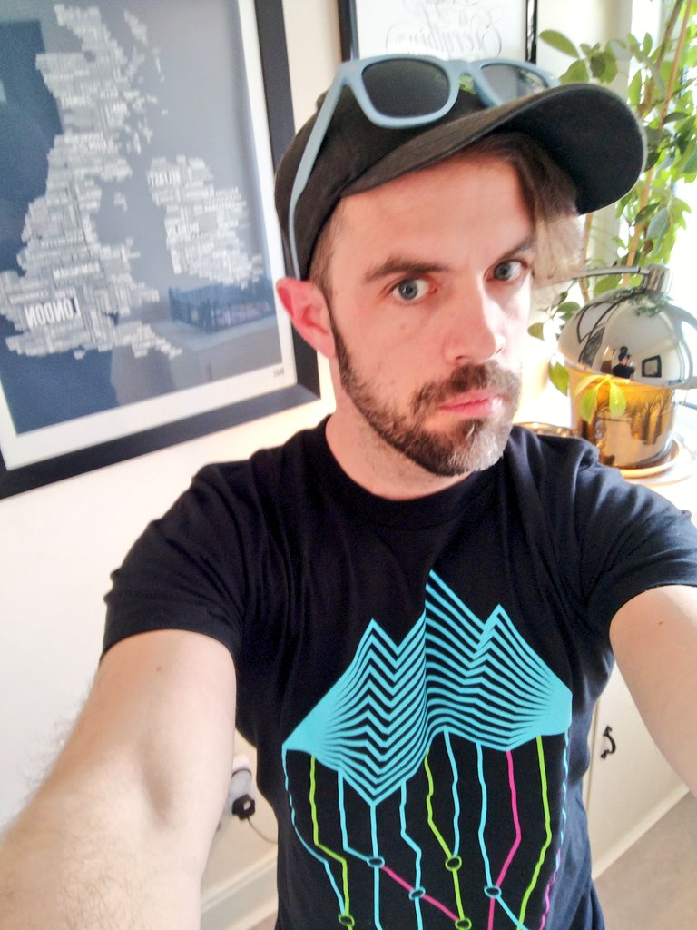 getdotmesh's tweet photo. Our shirts arrived today fo'realz. We'll be sending them out to folks really soon. In the meantime, here's one on a human doing an awkward selfie. (me). ^PC https://t.co/mo2dwbSLF4