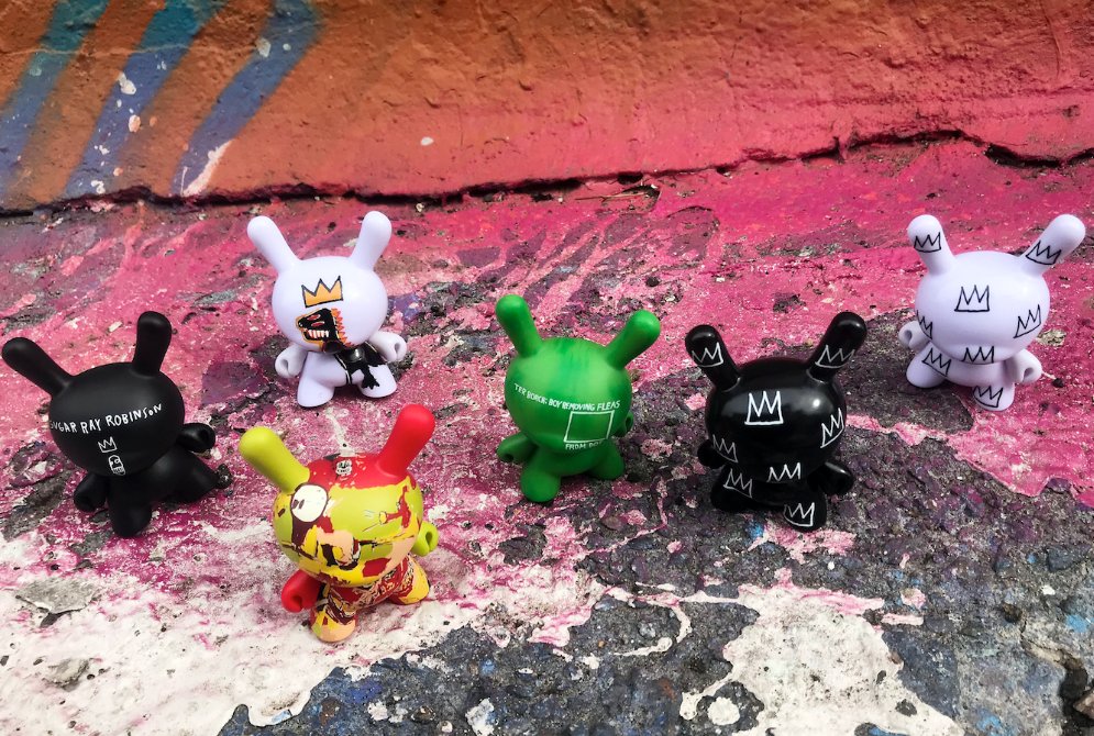 Kidrobot's tweet image. Originally inspired by the concrete jungle, the various medias of Jean-Michel Basquiat’s art comes to life on the Dunny! Get the new Jean-Michel Basquiat Dunny Mini Series online now at kidrobot.com and select retail stores! #Kidrobot #Dunny #Basquiat #Artestar