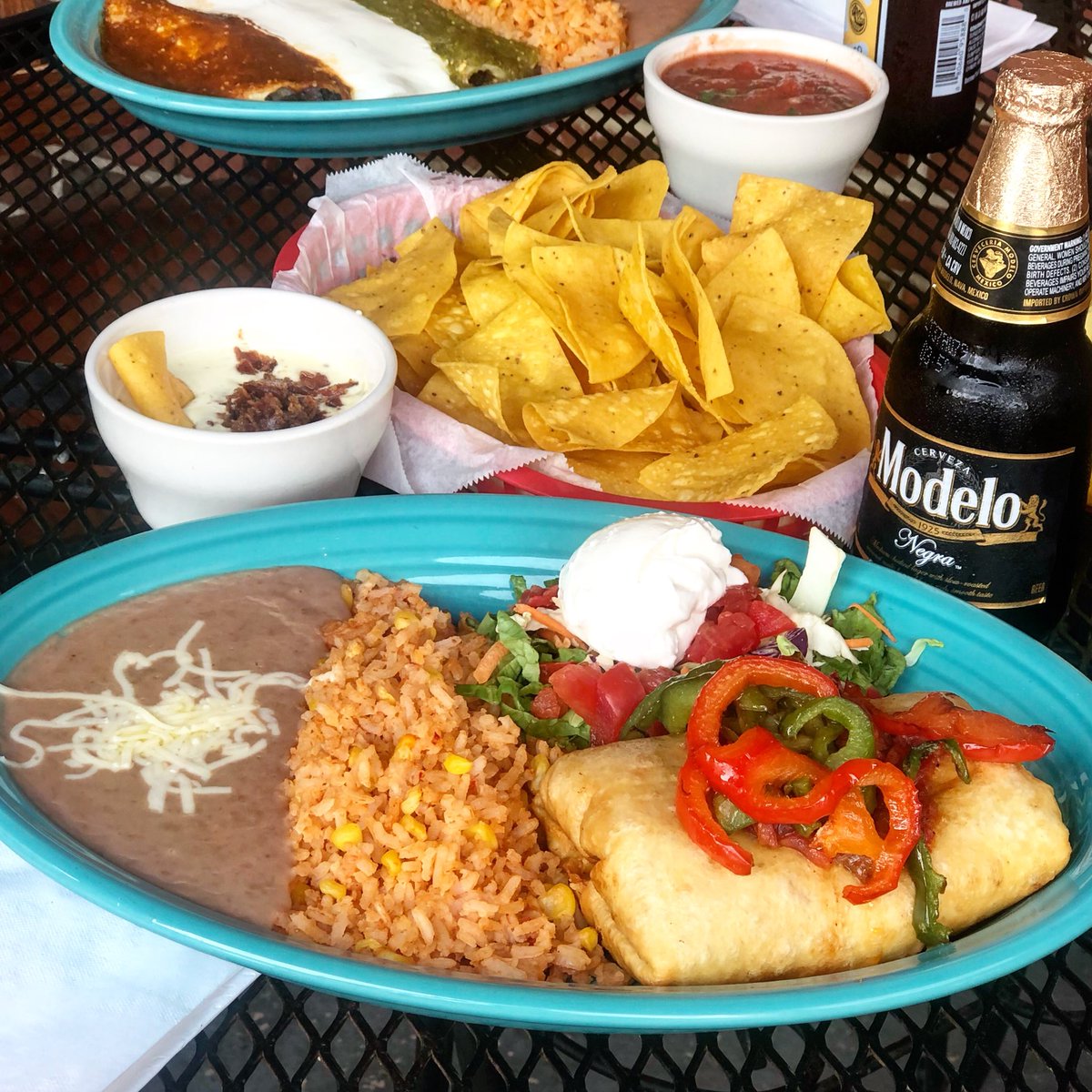 Stuffed with pulled chicken, spinach served with rice &amp; beans you can’t go wrong. Get some chips &amp; salsa, maybe some queso with bacon!! 🥓 #winningfriday #quesofriday #raleighfood #raleighfoodies