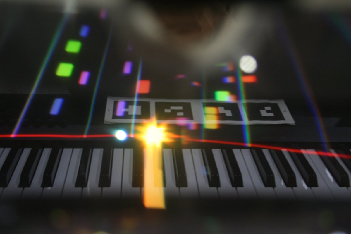 SergeShack's tweet photo. PianoBoard #AR as seen through #Aryzon headset visor #madewithunity 
Rainbow colors mode + full Aryzon support update coming really soon 🌈🎹 https://t.co/X09w3xbzKs