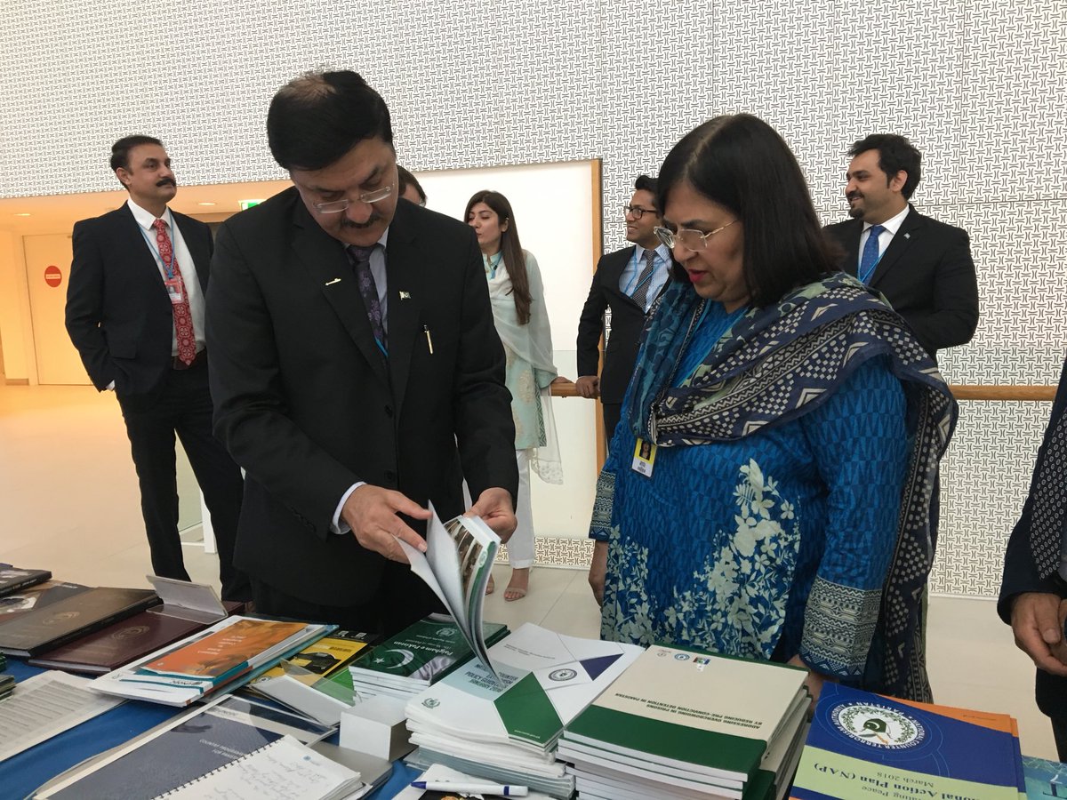UNODCPakistan's tweet photo. Head of Pakistan Delegation NC NACTA Mr Ihsan Ghani showing H.E Ayesha Riyaz Ambassador of Pakistan in Vienna, Pakistan Booth at #CCPCJ27 @CesarGuedesF @Arsalan88Malik @NACTAPK @ForeignOfficePk https://t.co/2RQtUKb3WX