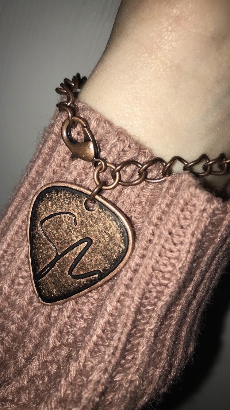 shawn mendes on X FanArtFriday This isn t really art but I made this bracelet out of the guitar pick from the perfume I had a blue rose symbolizing Roses and the