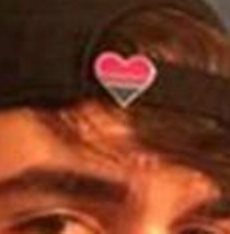 Dimitrios Pagourtzis wore bi-sexual pride heart pin and communist hammer and sickle pin